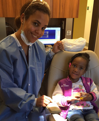 Photo of a dentist and a child