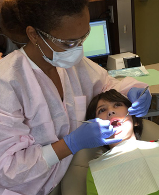 photo of a dentist during examination